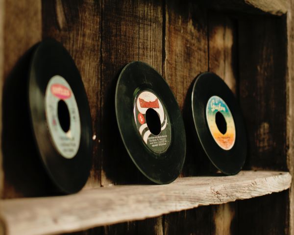 A shelf with records on
